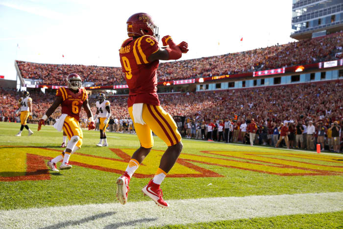 Iowa State football players celebrate.