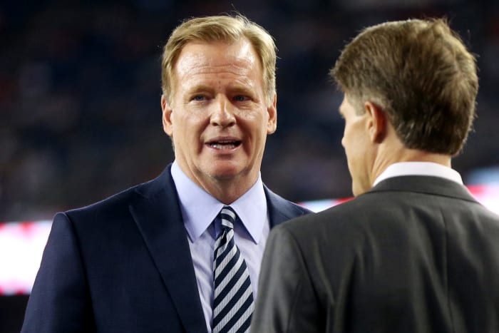 Roger Goodell talking to someone.