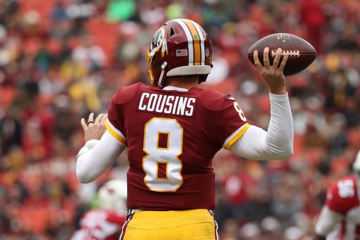 Kirk Cousins winding up to throw a pass.