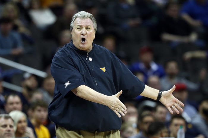 Bob Huggins reacting to something happening during a game.