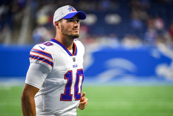 Mitchell Trubisky walks on the field before a game.