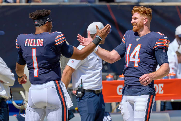 Justin Fields and Andy Dalton shake hands.
