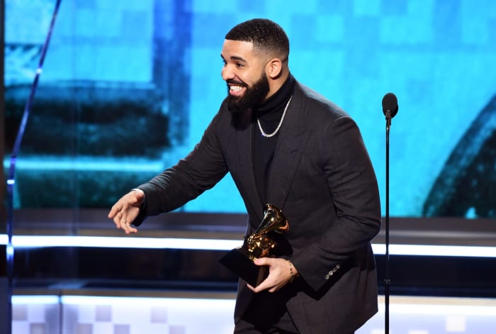Drake accepting an award.