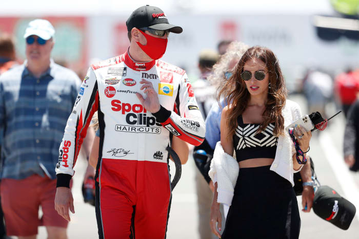 Kyle Bush and his wife Samantha at a NASCAR race