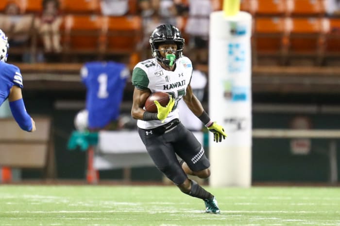 Jared Smart runs with the football.