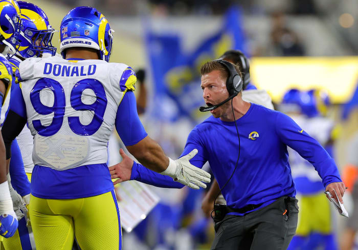 Sean McVay slaps hands with Aaron Donald.