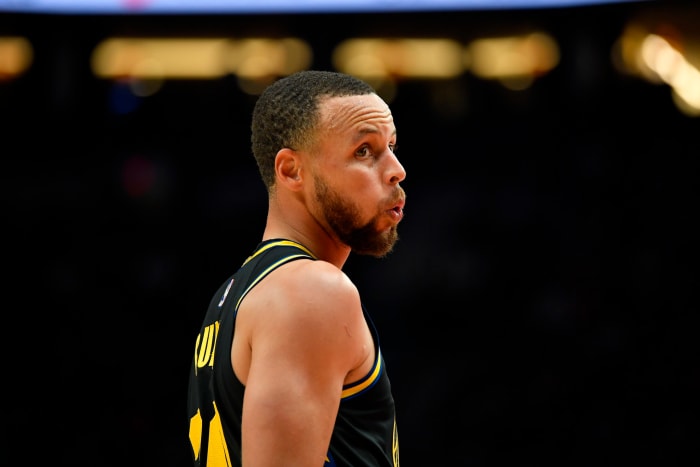 Warriors point guard Steph Curry warming up.