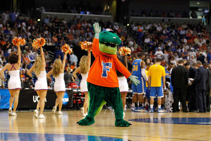 The Florida Gators mascot performing during a basketball game.