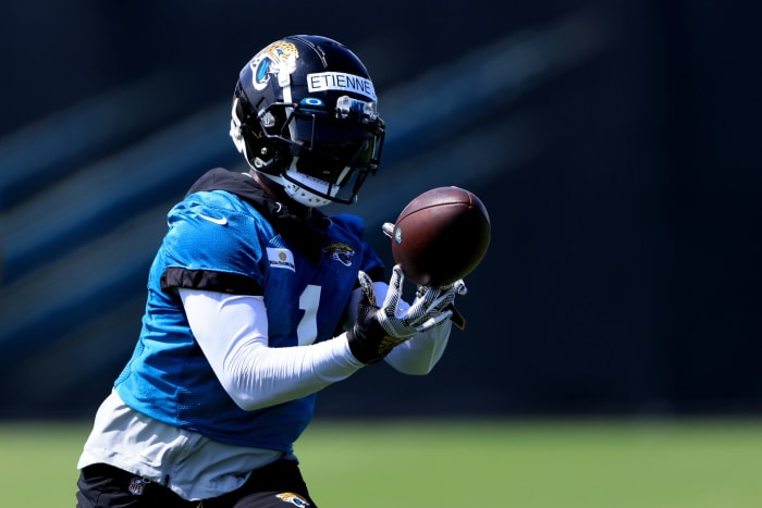 Travis Etienne catches a pass at Jaguars mandatory minicamp