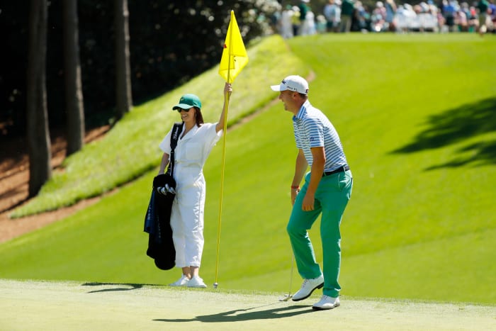 Justin Thomas with his girlfriend on the green.