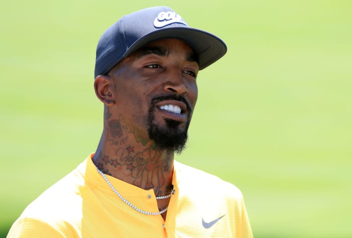 Former NBA shooting guard J.R Smith playing golf.