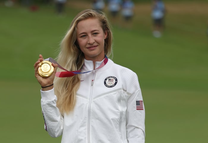 Nelly Korda poses with the gold medal.