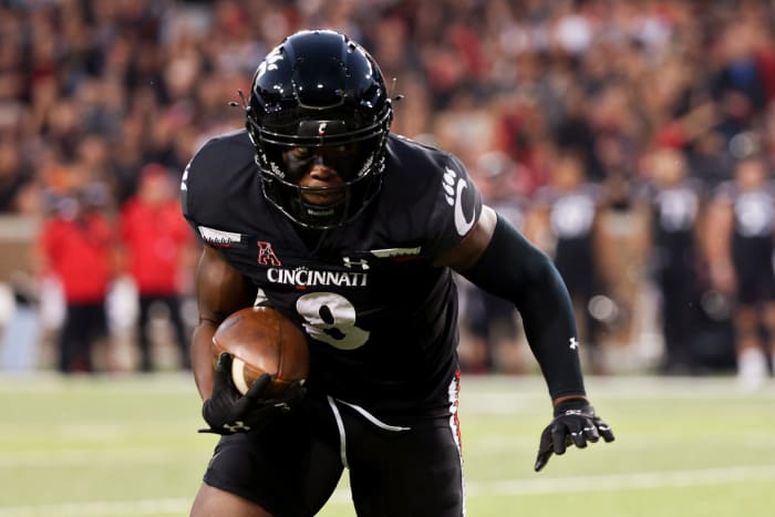 Michael Young of Cincinnati with the football.