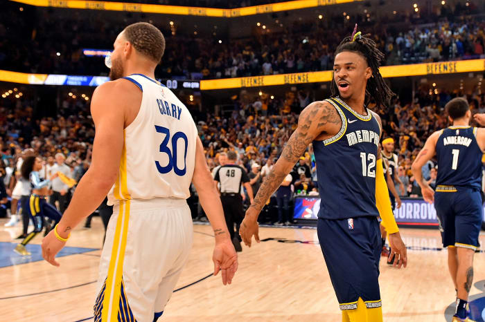 MEMPHIS, TENNESSEE - MAY 03: Ja Morant #12 of the Memphis Grizzlies and Stephen Curry #30 of the Golden State Warriors after Game Two of the Western Conference Semifinals of the NBA Playoffs at FedExForum on May 03, 2022 in Memphis, Tennessee. (Photo by Justin Ford/Getty Images)