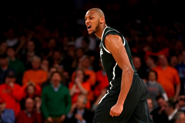 Former Michigan State men's basketball star Adreian Payne on the floor during a basketball game.