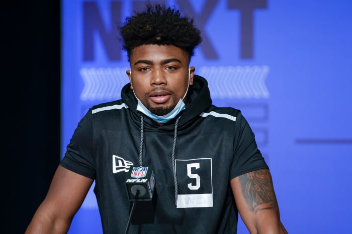 Treylon Burks talking at the NFL Scouting Combine in Indianapolis.