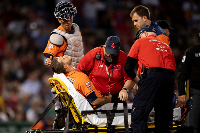 Astros pitcher Jake Odorizzi on a stretcher leaving the field.