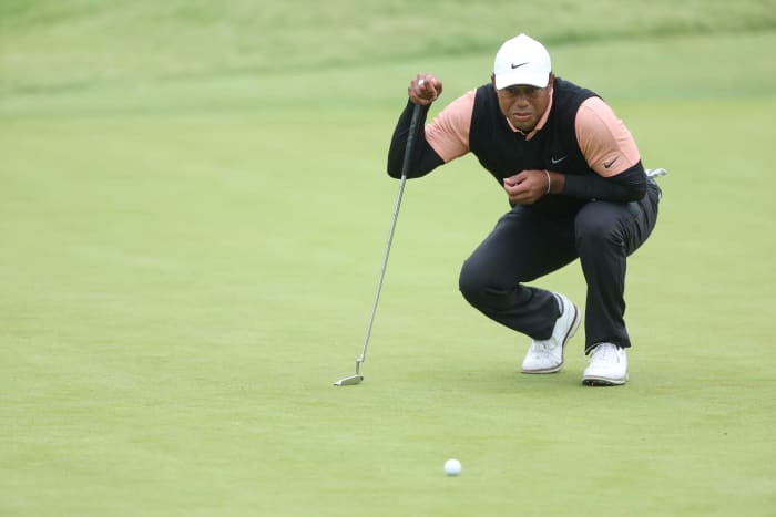 Tiger Woods reading a putt in the third round of the PGA Championship in Tulsa, Oklahoma.