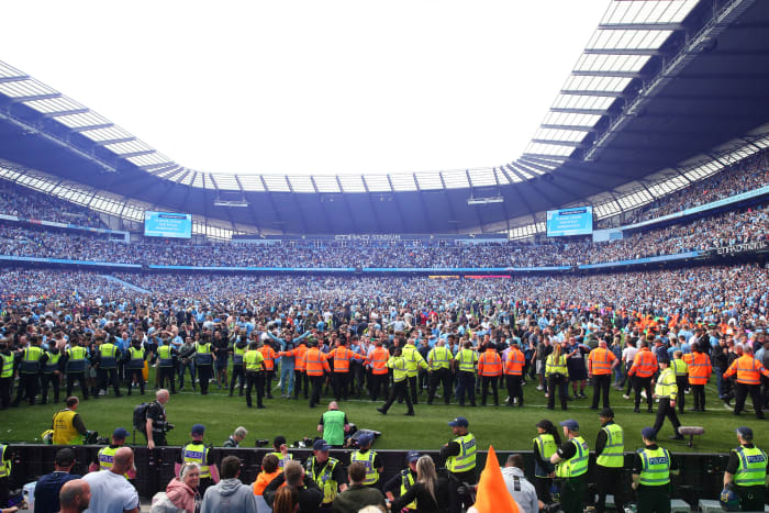 Manchester City fans celebrate during their Premier League title on Sunday afternoon.
