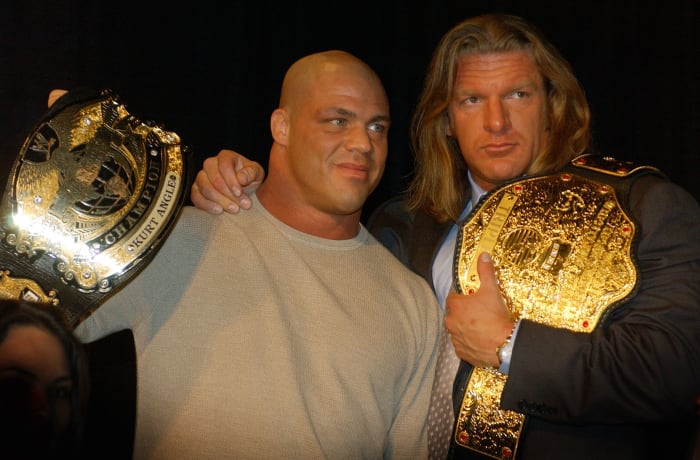 NEW YORK - MARCH 18:  World Wrestling Entertainment Wrestlers Kurt Angle (L) and Triple H attend a media conference announcing the all-star lineup of WWE WrestleMania XIX at ESPN Zone in Times Square March 18, 2003 in New York City.  (Photo by Mark Mainz/Getty Images)
