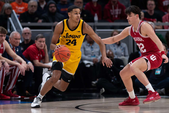 INDIANAPOLIS, IN - MARCH 12: Iowa Hawkeyes forward Kris Murray (24) dribbles past Indiana Hoosiers guard Trey Galloway (32) during the mens Big Ten tournament college basketball game between the Indiana Hoosiers and Iowa Hawkeyes on March 12, 2022, at Gainbridge Fieldhouse in Indianapolis, IN. (Photo by Zach Bolinger/Icon Sportswire via Getty Images)