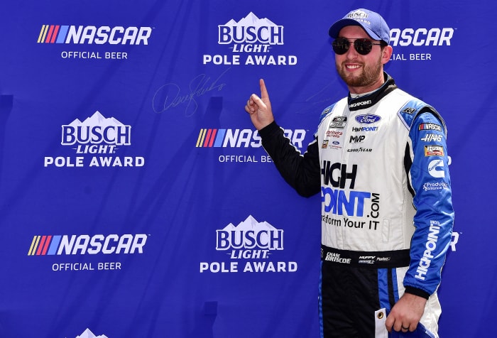 MADISON, ILLINOIS - JUNE 04: Chase Briscoe, driver of the #14 HighPoint.com Ford, signs the Busch Light Pole Award backdrop after winning the pole award for the NASCAR Cup Series Enjoy Illinois 300 at WWT Raceway on June 04, 2022 in Madison, Illinois. (Photo by Jeff Curry/Getty Images)