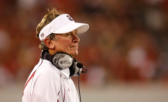 A closeup of Steve Spurrier wearing a visor on South Carolina's sideline.
