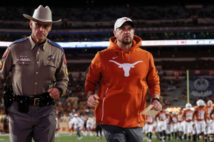 Texas head coach Tom Herman running off the field after a game vs. Iowa State.