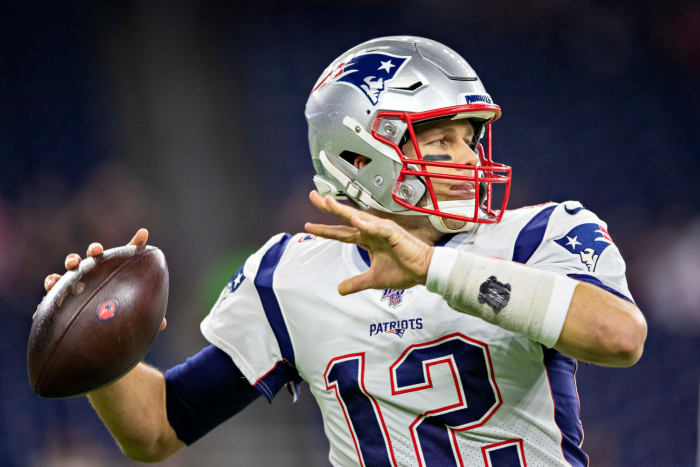 Tom Brady throws an interception in the first half against the Texans.