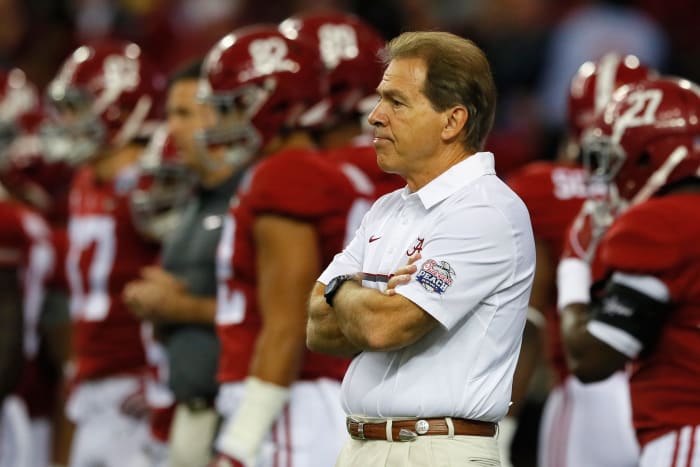Nick Saban crossing his arms.