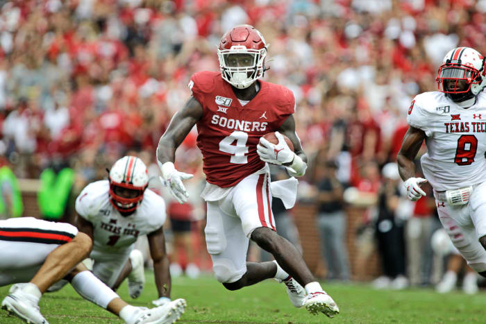 Oklahoma running back Trey Sermon carries the ball in a game.
