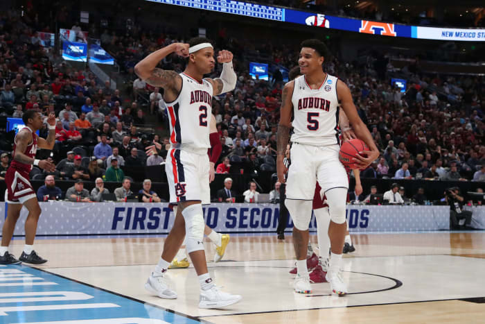 Chuma Okeke and Bryce Brown on the floor.