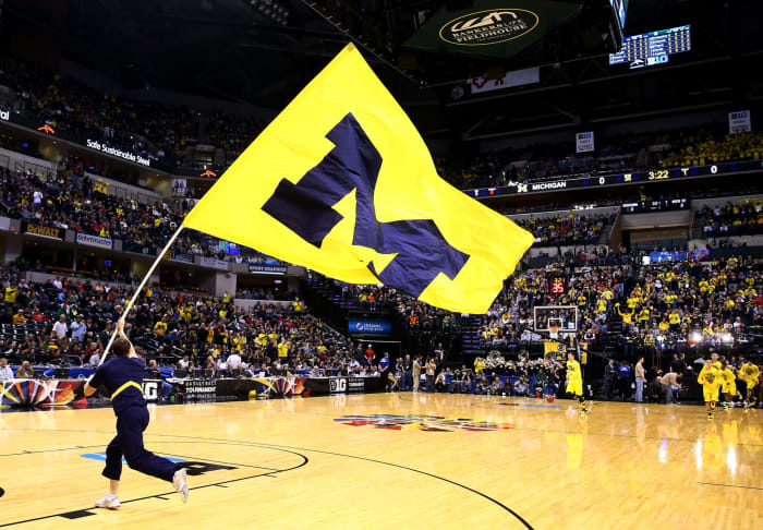 A University of Michigan flag is seen on the court prior to the 2014 Big Ten Men's Championship between the Michigan Wolverines and the Michigan State Spartans.
