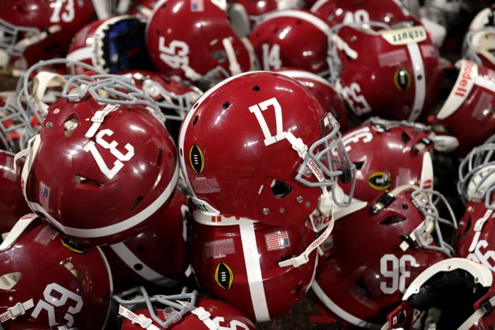A detailed view of Alabama Crimson Tide helmets in a pile during the celebration after the CFP National Championship.