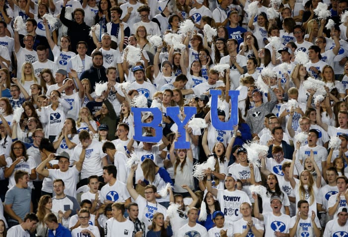 BYU fans holding up a BYU sign.