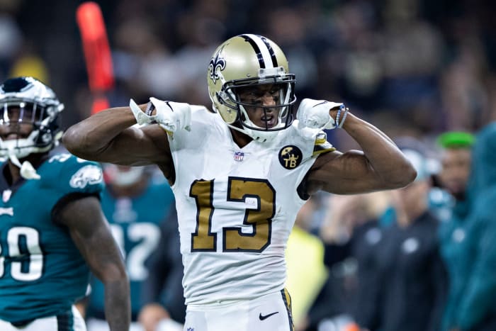 Michael Thomas flexing his biceps during a New Orleans Saints game.