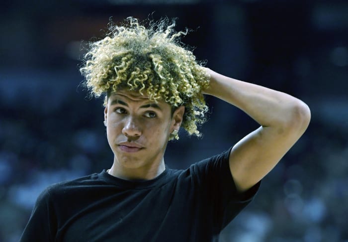 lamelo ball walks off of the court during a summer league game