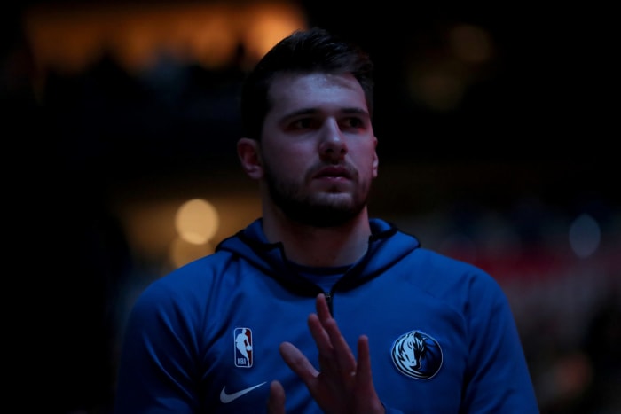 Luka Doncic warms up before a Mavericks-Suns game.