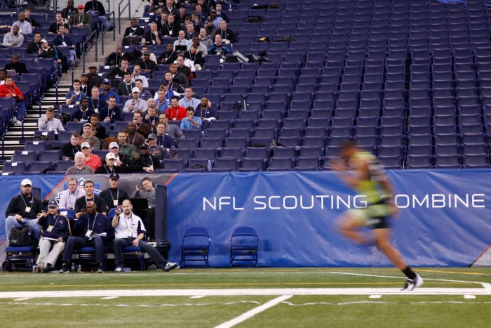nfl coaches watch the scouting combine