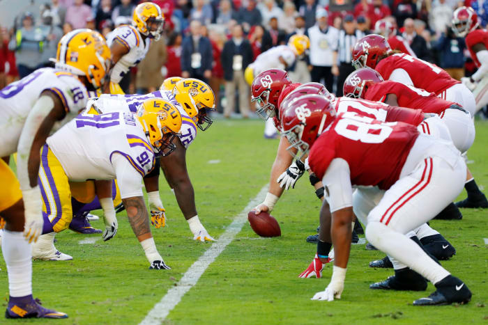 Alabama and LSU players line up during a huge SEC college football showdown at Bryant-Denny Stadium.