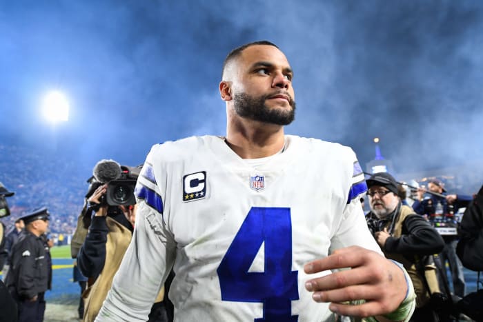 Dallas Cowboys QB Dak Prescott walking off the field after a game. The potential Dak Prescott contract is a major offseason storyline.