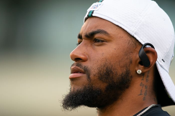 DeSean Jackson wears headphones on the field before a game.