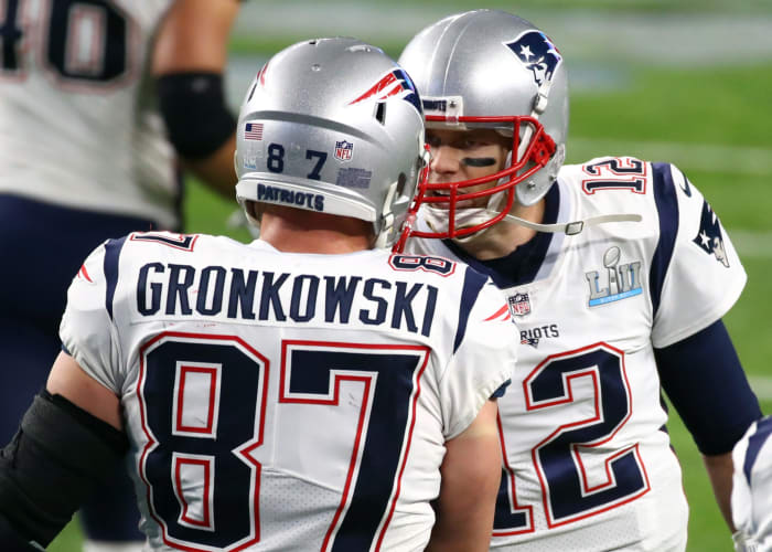 Tom Brady talking to Rob Gronkowski.