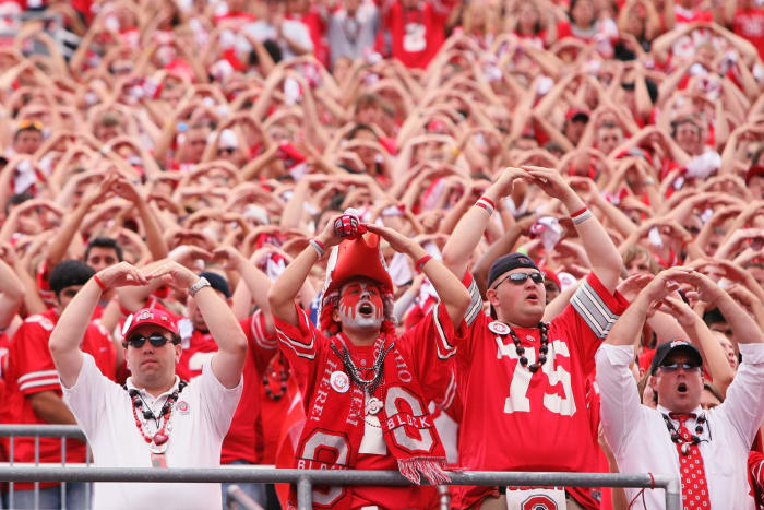 Ohio State Buckeye fans doing the "O-H-I-O" chant.