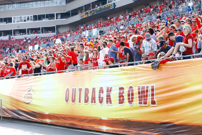 fans look onto the field during the outback bowl