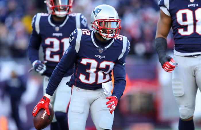 Devin McCourty celebrating after a fumble recovery.