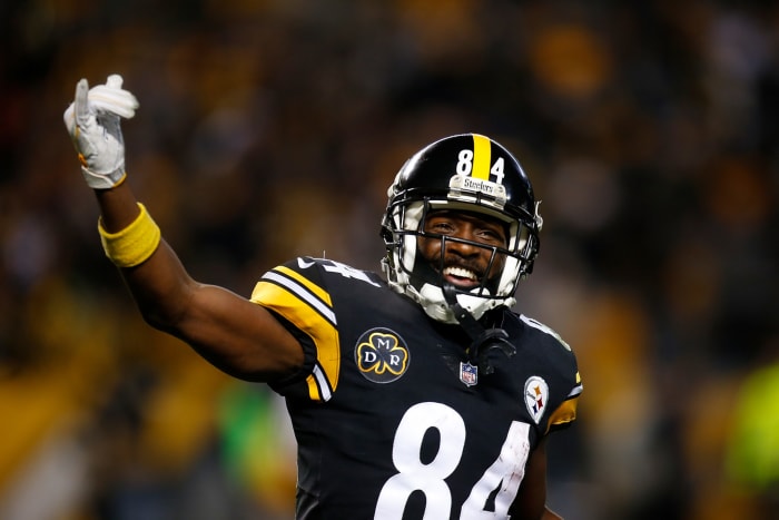 A closeup of Antonio Brown smiling during a game.