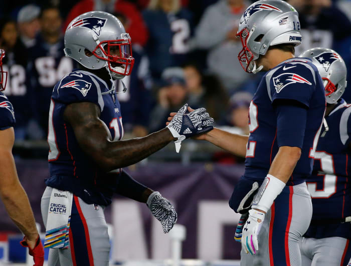 Tom Brady and Josh Gordon celebrate the win over the bills