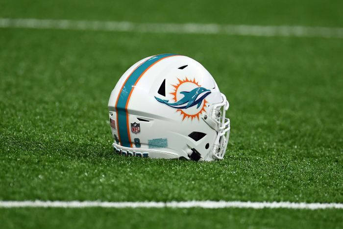 Miami Dolphins helmet sits on the turf.