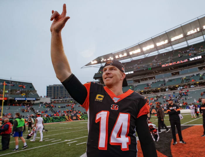 Andy Dalton waves to Bengals fans.